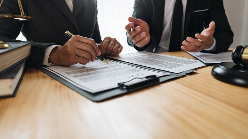 Lawyer, legal advisor, businessman brainstorming clarifying agreement details business contract Joint financial investments in office real estate projects.