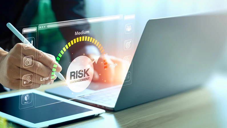 Digital risk management dashboard on a laptop, highlighting strategies for revenue diversification and business stability.