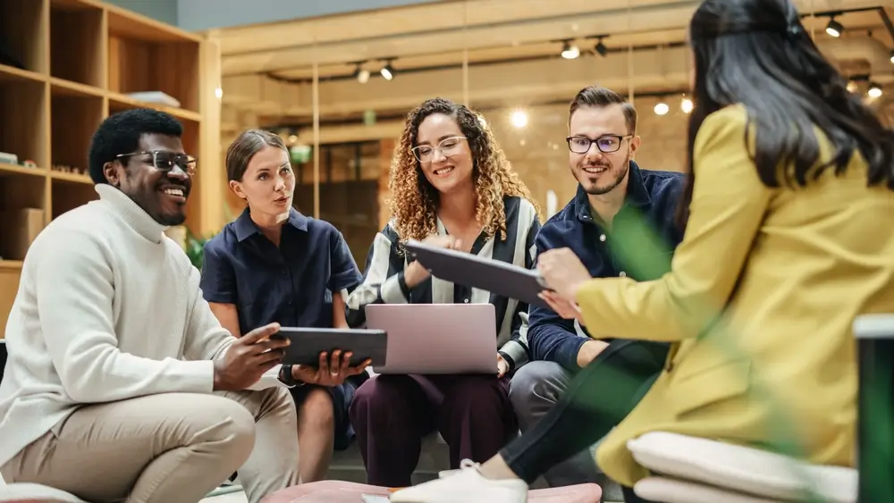 Multiethnic Group of People Meeting and Discussing Innovative Ideas in a Casual Conference Room