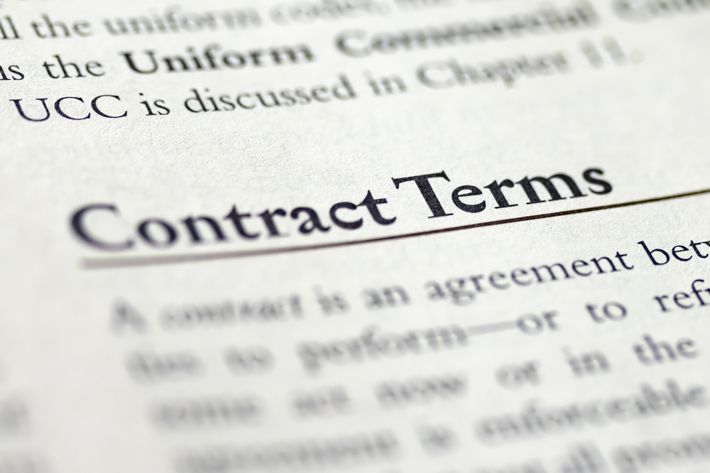 Close-up of a government contracting document highlighting contract terms, legal clauses, and business obligations.