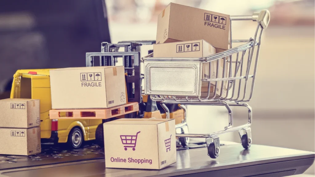 Logistics, supply chain and delivery service for e-commerce, online shopping concept : Boxes, shopping cart, fork-lift truck, delivery van on a laptop computer, depicts using internet to order goods