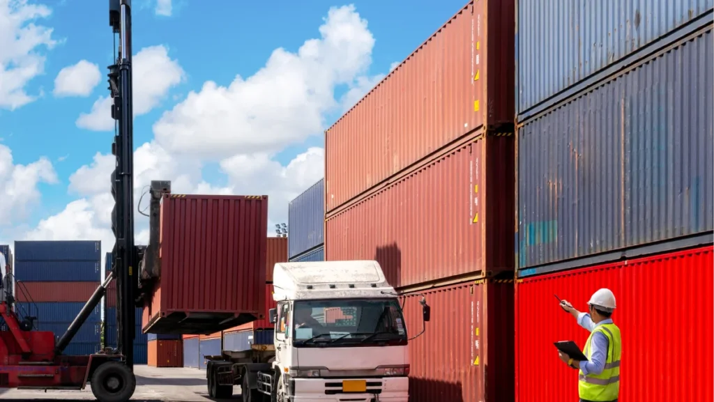 Foreman control loading Containers box from Cargo freight ship for import export. Logistic Concept