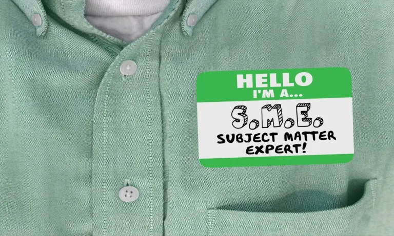 subject matter expert sticker on chest of man wearing green shirt