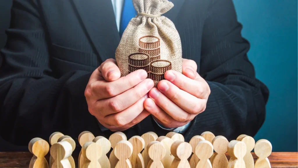 Businessman holds out a money bag to the crowd. Official. Staff maintenance. Tax collection. Compensation payments. Share profit. Providing money, paying salaries and grants. Financial support.