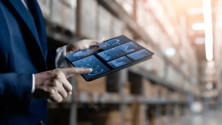 Close up, Woman worker or supervisor uses a digital tablet to check the stock inventory, a Smart warehouse management system, supply chain and logistic network technology concept.