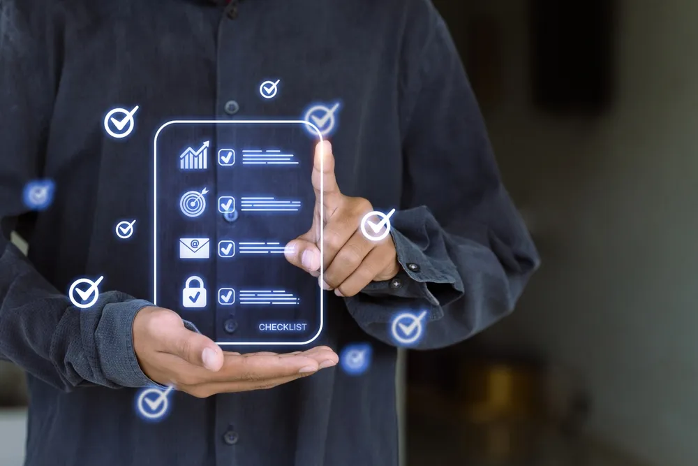 Professional pointing at a digital checklist, illustrating the hidden ROI of Proposal Team Review through task tracking.